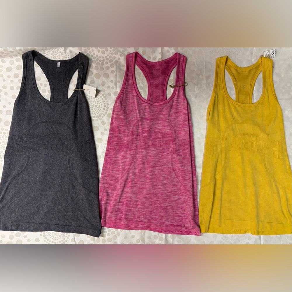 23. Bundle of 3 - Lululemon Swiftly tanks- size 6, grey, pink, yellow